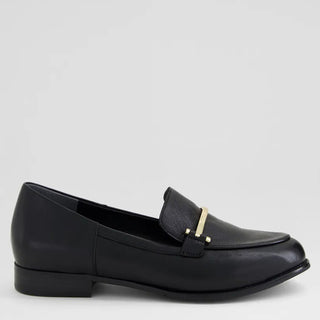 Black loafer shoe on a light gray background
